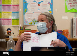 Austin, Texas, USA. 6th Oct, 2020. Under the careful watch of third grade  teacher JEANINE DOYLE and with plenty of PPE ready, in-person learning  takes off once again during the second day