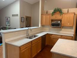 Symphony grey quartz kitchen countertop. Msi Portico Cream Stone Aceno Granite Kitchen And Bath Facebook