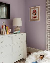 To accessorize a bedroom dresser. White And Purple Girls Room With Tv Over Dresser Transitional