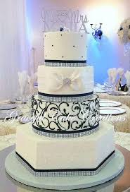 Black And White Wedding Cakes With Bling Elegant White Butter Cream Wedding Cake With Navy Blue And Rhinestone Bling Ribbon Cream Wedding Cakes Bling Wedding Cakes Black And White Wedding Cake
