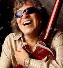 Name the tune and artist of an English song by a Puerto Rican singer. 🇵🇷