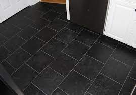 Complete the sophisticated design by adding in a matching granite countertop. Black Color Kitchen Floor Image Black Tiles Kitchen Black Kitchen Floor Tiles Black Floor Tiles