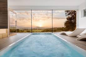 An indoor pool is quickly becoming popular a popular addition to homes. 20 Beautiful Indoor Swimming Pool Designs