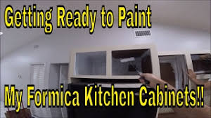 Formica plastic laminate is commonly used to cover kitchen surfaces such as cabinets. Getting Ready To Paint My Formica Kitchen Cabinets Remove Cabinet Hardware Prime Inside Cabinets Youtube