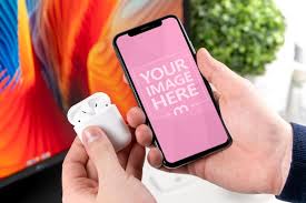 Mockup Template Of A Man Holding An Iphone And A Pair Of Wireless Headphones In Hand Use This Template To Showcase Your Iphone Mockup Generator Iphone Online