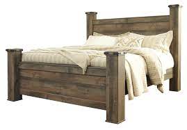 Check spelling or type a new query. Trinell King Poster Bed In Warm Rustic Oak Clearance