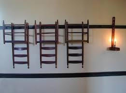 Chair rail by definition is molding on an interior wall that is attached horizontally around the the term chair rail is said to have been coined by the shakers who placed wood and pegs on the walls in. Wood Peg Collection Hangs All Your Furniture On Your Wall