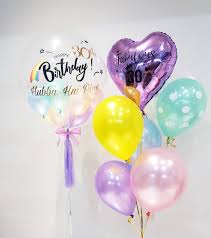 Happy multicultural girlfriends and young pregnant woman holding flowers and gift while taking selfie on baby shower with pink balloons. Balloon Delivery Singapore 11 Places Services For Gifts Decor