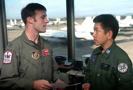 U.S. Air Force CAPT Russ Hall (left), an F-15 Eagle aircraft pilot from the  67th