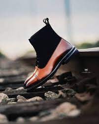 4k00.11full shot of african american man tying his shoes sitting at outdoor stairs with female friend having pair workout on sunny morning talking and enjoying training together. Black Owned Men S Shoe Brands Shoppe Black