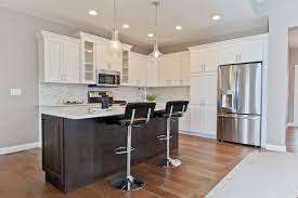 Two Tone Kitchen Cabinets Featuring White And Flagstone Cabinets In New Construction Home In Cedar Rapids New Home Communities Home Two Tone Kitchen Cabinets