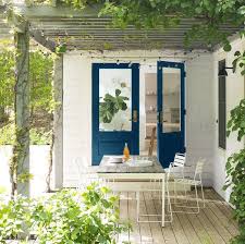 benjamin moore on instagram a bold blue door can create an inviting backdrop for your yard all ye best white paint white paint colors front door paint colors front door paint colors
