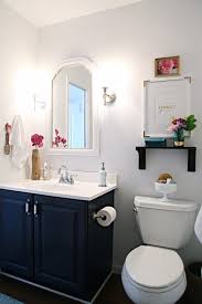 Navy Bathroom Decorating Ideas Darling Small Bath Makeover With Blue Vanity Cabinet White And Bathroom Makeover Blue Bathroom Vanity Bathroom Vanity Makeover