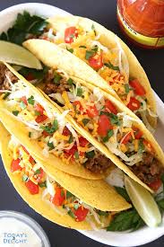 Ground Beef Tacos Are Easy To Make With Seasoned Ground Beef Topped With Shredded Lettuce Cheese Cilantro And In 2020 Ground Beef Tacos Beef Tacos Recipes Tacos Beef