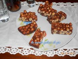 Torrone morbido di mandorle siciliane e miele di zagara ricoperto di cioccolato fondente, cioccolato bianco, cioccolato al limone, cioccolato all'arancia. Torrone Morbido Con Nocciole E Miele La Tavola Golosa Di Gio