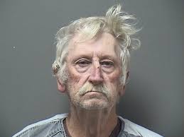 Man charged with firing shots in house with kids