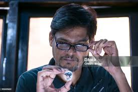 Young Diamond Merchant Is Looking At Diamond Stock Photo