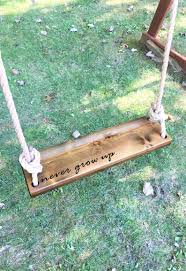 Never Grow Up Wooden Rope Swing Dark Wood Tree Swing Etsy Tree House Diy Outdoor Wooden Swing Wood Tree Swing