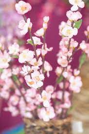 How to arrange fake flowers in a vase. How To Arrange Silk Flowers In A Tall Vase With A Narrow Opening Hunker Tall Flower Arrangements Flower Vase Arrangements Silk Flowers