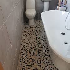Pebble stone is a very beautiful and exceptional flooring structure, and it is also a great support system for tiles. Pebble Tiles Pebble Flooring Pebble Paths Pebble Garden Design Showers Pebble
