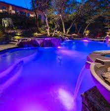 Light Up Your Night With These Colorful Led Pool Lights Premierpools Pool Home Lifestyle Backyardoasis Landscape Family Pool Lights Pool Pool At Night