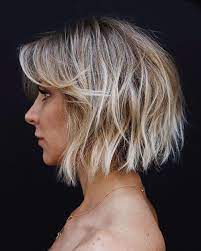 This hairstyle frames your face with thick strands that have a light wave for an elegant look, making it one of our favorite short haircuts for thick hair. Pin On Screenshots