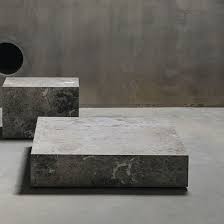 The coffee table has a white, marble tabletop and black, iron table base. Contemporary Coffee Table Edge L Tundra Grey Maami Home Marble Marble Base Square