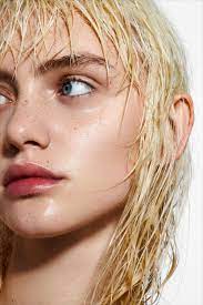 Wet, blonde, messy woman's hair after shower on the gray background. Wet Hair Portrait Beauty Portrait Beauty Shoot German Beauty
