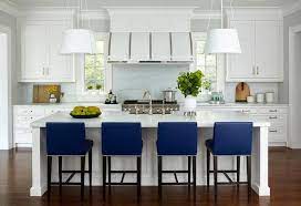 Here's a more monochromatic white kitchen that we found while scrolling through pinterest. Royal Blue Counter Stools Provide A Comfortable Low Profile Perch At A White Kitchen Island Offering A Kitchen Design Stools For Kitchen Island Modern Kitchen
