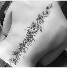 28 Delicate But Beautiful Spine Tattoo Designs For Women The Xo Factor Flower Spine Tattoos For Women Spine Tattoos For Women Spine Tattoos For Women Flowers