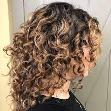 Besides lots of layered haircuts that can amp up your curl pattern, there are also a bunch of ways to customize the. The Best Medium Length Naturally Curly Hairstyles Southern Living