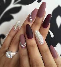 Beautiful female hand with beige nail design. Here Are Nails Done In Various Shades Of Purple A Special Seal Leaves The Glitter Gel On One Nail Of Rhinestone Nails Coffin Shape Nails Nail Art Rhinestones