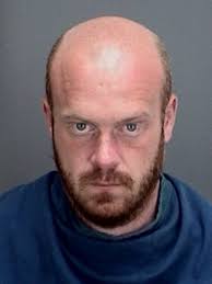 Suspect charged in motel room sex assault