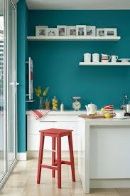 Bright Teal Walls Look Great Against White Gloss Kitchen Cabinets And The Accent Of Red Further Lifts The Rich Colour Blue Painted Walls Teal Walls Home