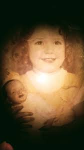 My oldest sister with her doll and her dog. I believe this was taken