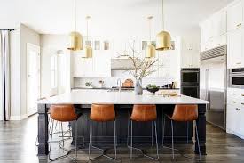 Kanisha gilchrist kitchen island set with manufactured wood top. Orange Leather Stools At Black Kitchen Island Transitional Kitchen