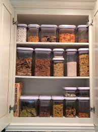 When you're planning how to organize your kitchen, don't be afraid to take cues from other rooms in your home. Kitchen Cabinet With Oxo Containers Kitchen Containers Kitchen Organization Pantry Kitchen Hacks Organization