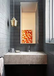 Make sure the fixture isn't extended past the mirror to avoid down lighting, which will cast shadows on the face. 7 Top Materials For Your Bathroom Vanity Benchtop Houzz Bathroom Lighting Beautiful Bathrooms Lighted Bathroom Mirror