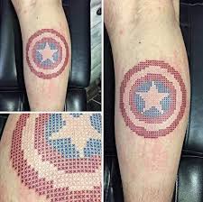 The original work on the captain american shield / winter soldier shoulder tattoo, as well as other additions to the sleeve of nerdom in progress. 25 Awesome Marvel Superhero Captain America Tattoos Entertainmentmesh