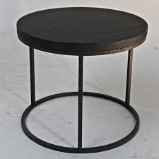 The iron joints add a great contrast for a complete look. Round Black Oak Top Side Table With Cast Iron Base Omero Home