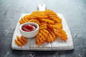 They are made of potato, oil, and seasonings. Crispy Potato Waffles Fries With Ketchup On White Wooden Board Stock Photo Picture And Royalty Free Image Image 103953350