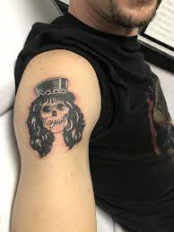 Slash his & her tattoos. 9 Slash Tattoo Ideas In 2021 Slash Guns And Roses Music Tattoos