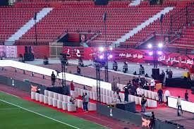 ويلعب الأهلي ضد الإنتاج الساعة التاسعة مساء يوم الجمعة المقبل في الجولة الـ19 من الدوري المصري الممتاز، في مواجهة ستكون الأولى على الملعب بشكله الجديد. Ø§Ø³ØªØ§Ø¯ Ø§Ù„Ø£Ù‡Ù„ÙŠ ÙŠÙƒØªØ³ÙŠ Ø¨Ø§Ù„Ù„ÙˆÙ† Ø§Ù„Ø£Ø­Ù…Ø± Ù‚Ø¨Ù„ Ø§ÙØªØªØ§Ø­Ù‡ Ø¨Ø´ÙƒÙ„ Ø±Ø³Ù…ÙŠ ØµÙˆØ± Ø§Ù„ÙŠÙˆÙ… Ø§Ù„Ø³Ø§Ø¨Ø¹