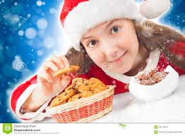Happy Christmas girl eating Christmas cookies - happy-christmas-girl-eating-christmas-cookies-28179919