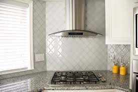 Arabesque tile backsplash is a vertical extension of the countertop that protects the walls from unwanted splashes of water, oil or seasonings. White Glass Arabesque Tile Backsplash Contemporary Kitchen Houston By Elnaz Irby Design Houzz