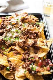 Brown the ground beef and onions in a skillet or sauté pan over medium heat until beef is no longer pink and onions are softened. Ripper Beef Nachos Recipetin Eats
