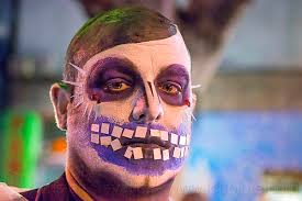 man with purple skull makeup