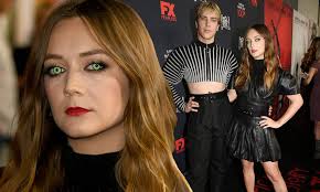 Billie Lourd goes for gothic glam and green eyes as Cody Fern flashes his  midriff at AHS party