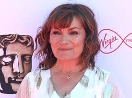 Lorraine Kelly looks gorgeous in a vibrant orange dress