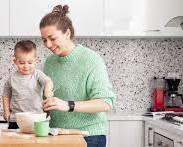 Image of happy person home cooking or budget planning simple lifestyle photo reference